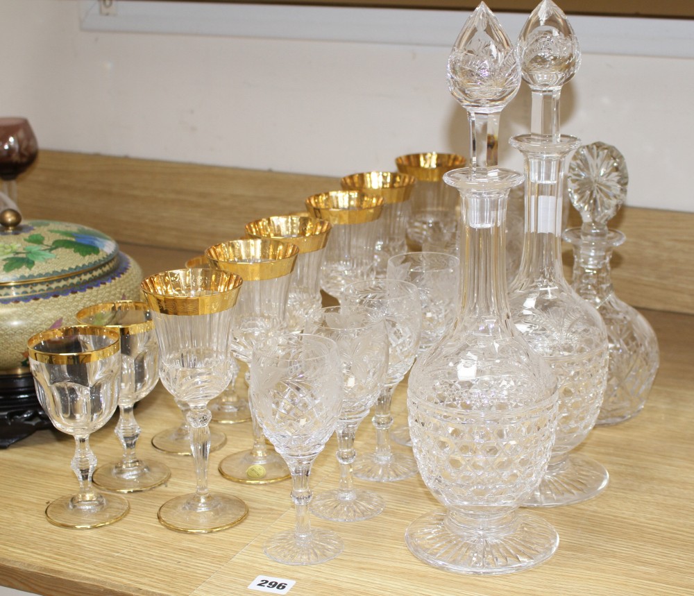 A pair of Stuart? cut glass decanters and stoppers, another decanter, a set of eight vineous etched wine glasses and a set of six Itali